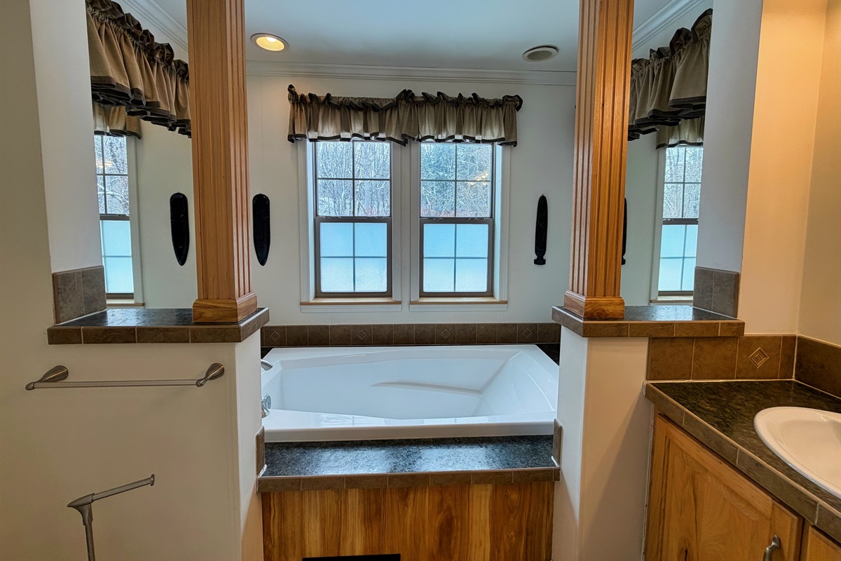 Primary bathroom with jetted tub and shower.