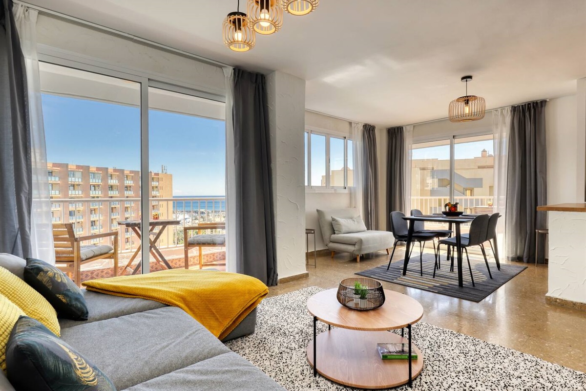 Specious and sunny living room with views over the sea and beautiful Benalmadena port