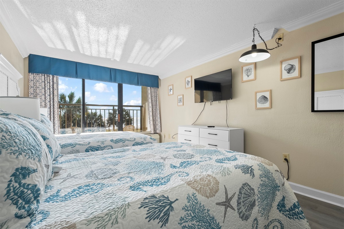 Main Bedroom with two queen beds and a direct oceanfront view