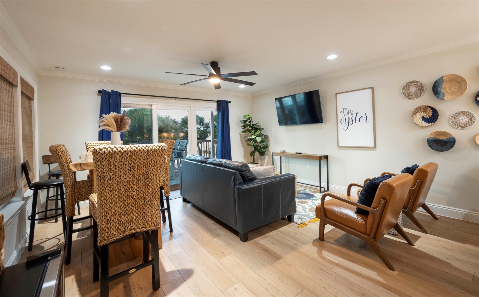 Professionally decorated living room with cozy seating, modern decor, and abundant natural light.