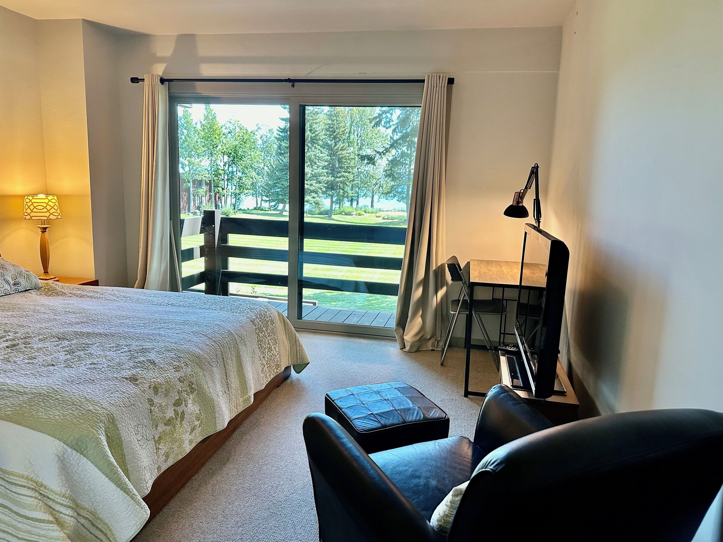 Master bedroom has desk and flat screen TV