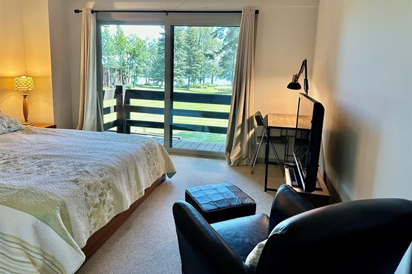 Master bedroom has desk and flat screen TV