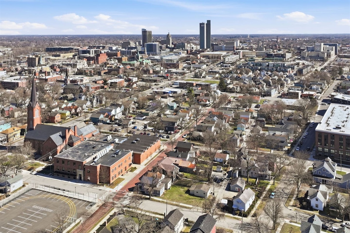 Expansive city view capturing the home’s location within a vibrant urban setting