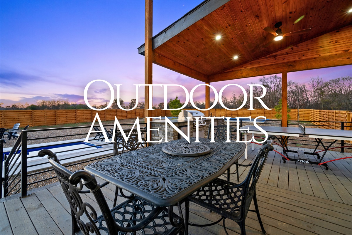 This spacious outdoor dining area sits beneath a covered deck, giving you plenty of room to enjoy meals while taking in the sunset views.