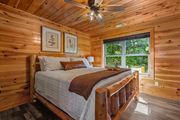 Downstairs king bedroom with peaceful wooded views