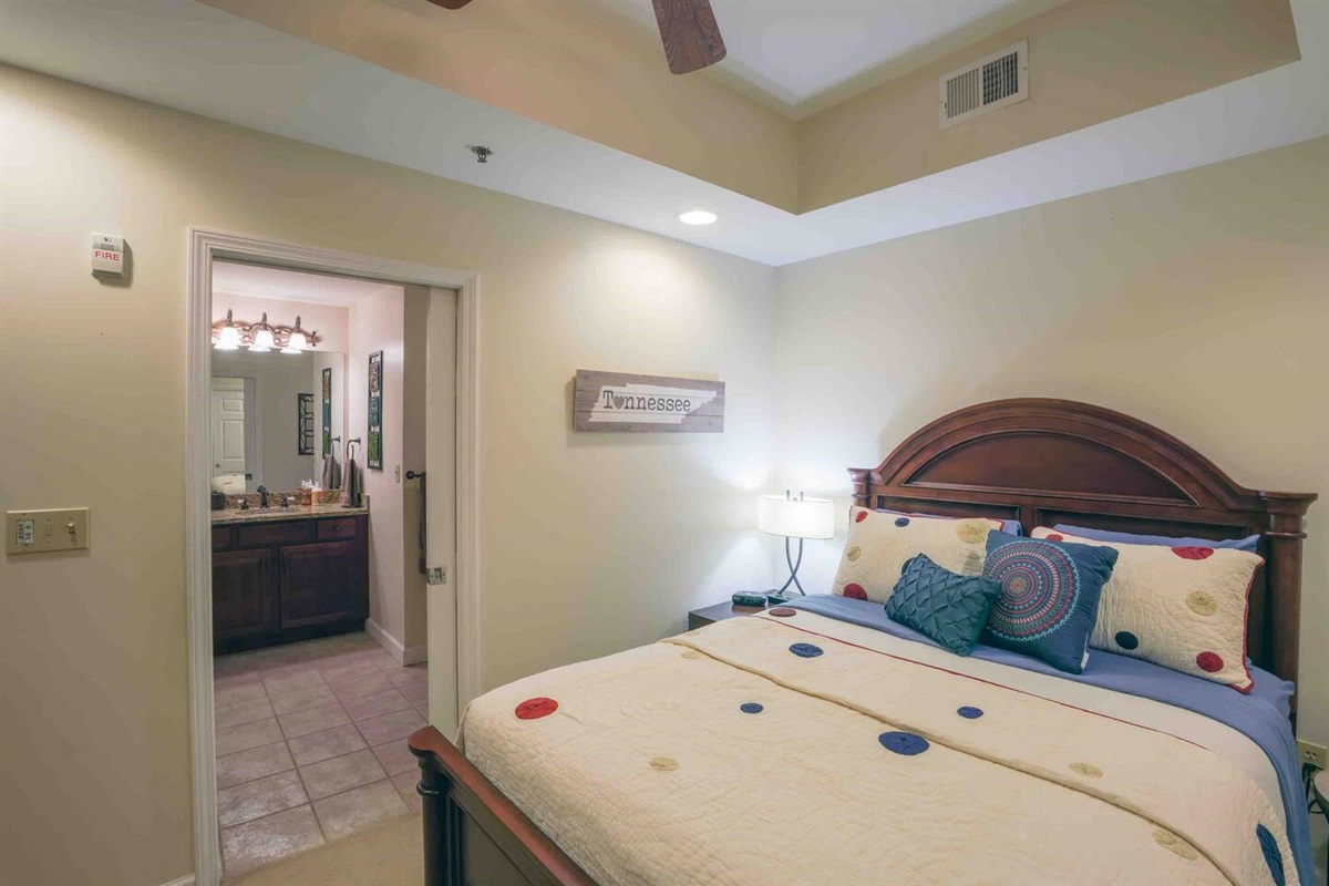 The second bedroom features a comfortable queen size bed and a private ensuite bathroom.