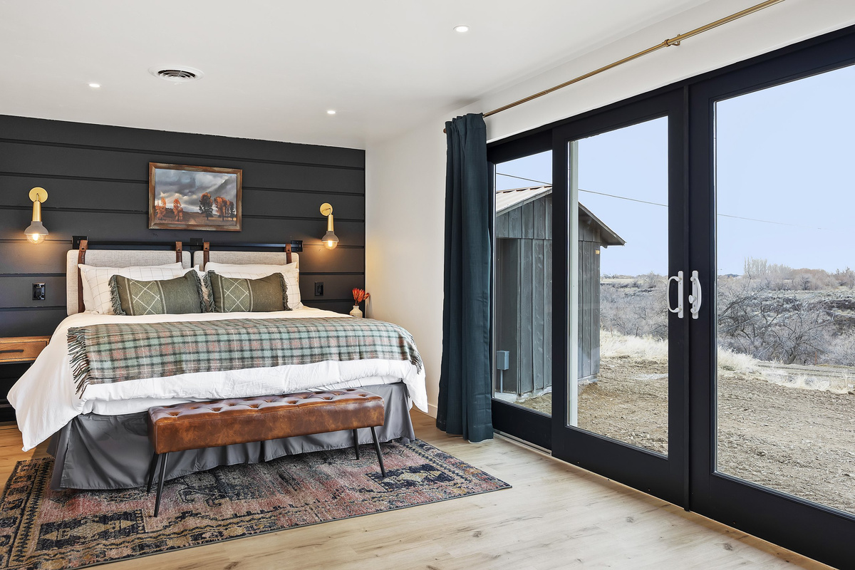Wake to canyon and country views through the master's floor-to-ceiling glass door