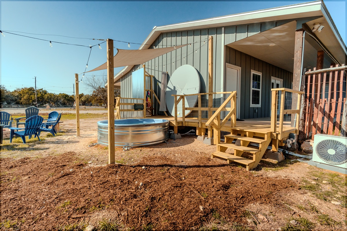 Cowboy pool, shaded deck, and private Game Barn set on a spacious Hill Country lot.