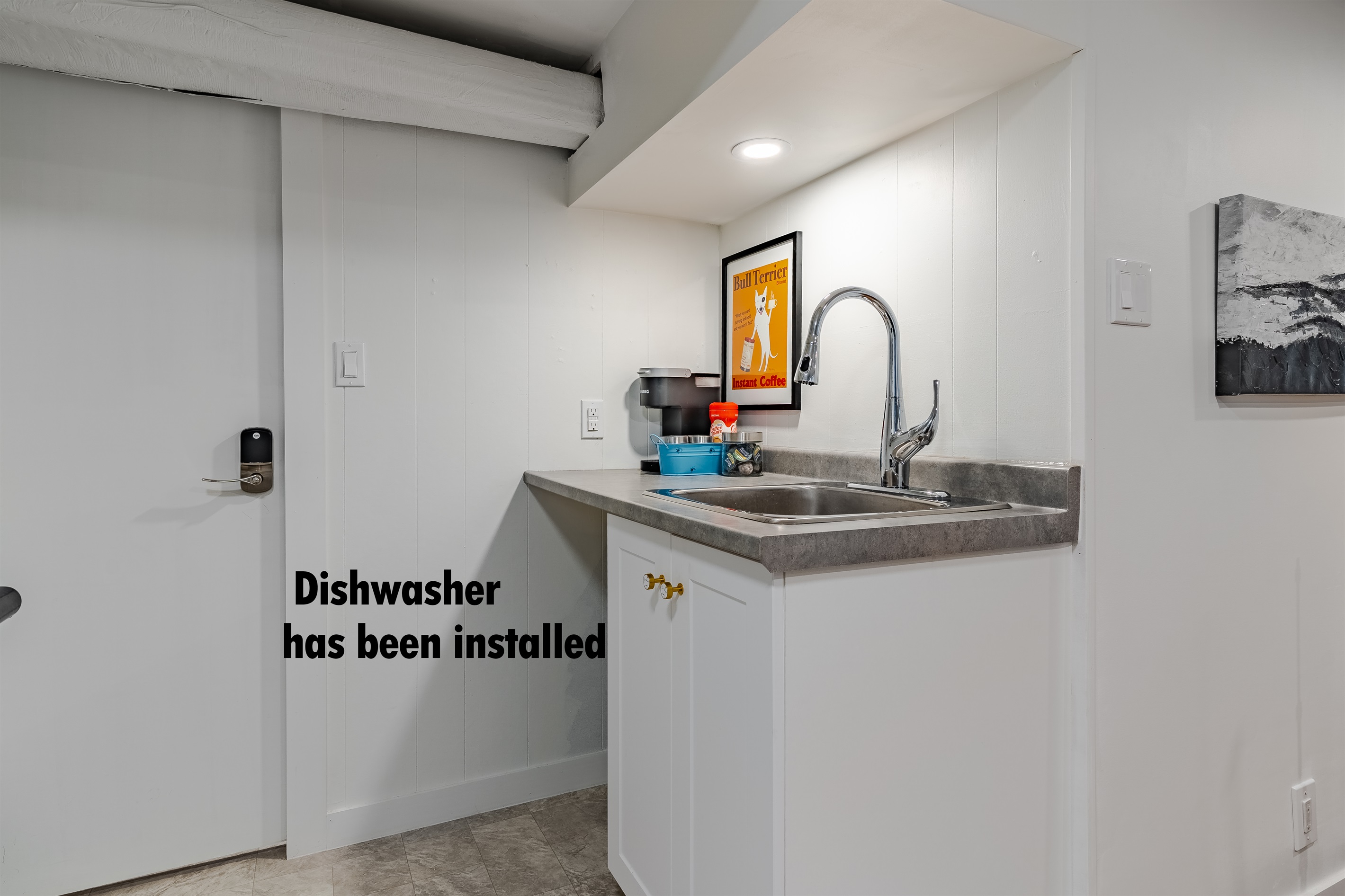 Sink with dishwasher for easy clean-up during your stay.