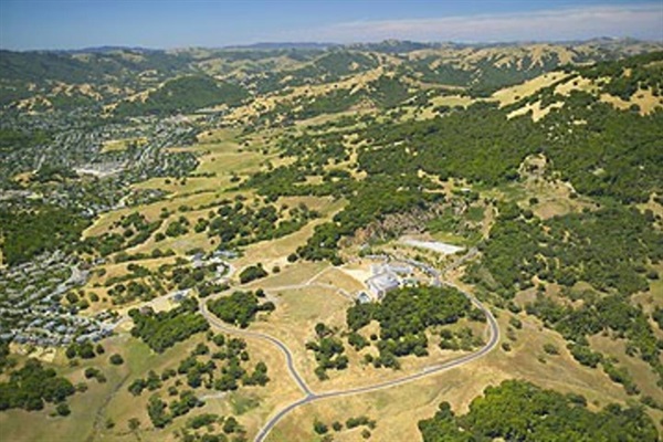 Wide aerial look at rolling hills & open landscapes