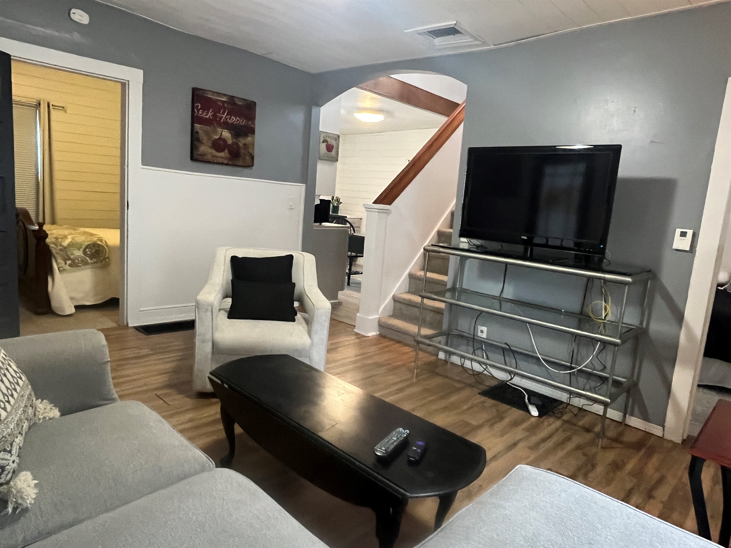 Living room with Queen bedroom and kitchen beyond