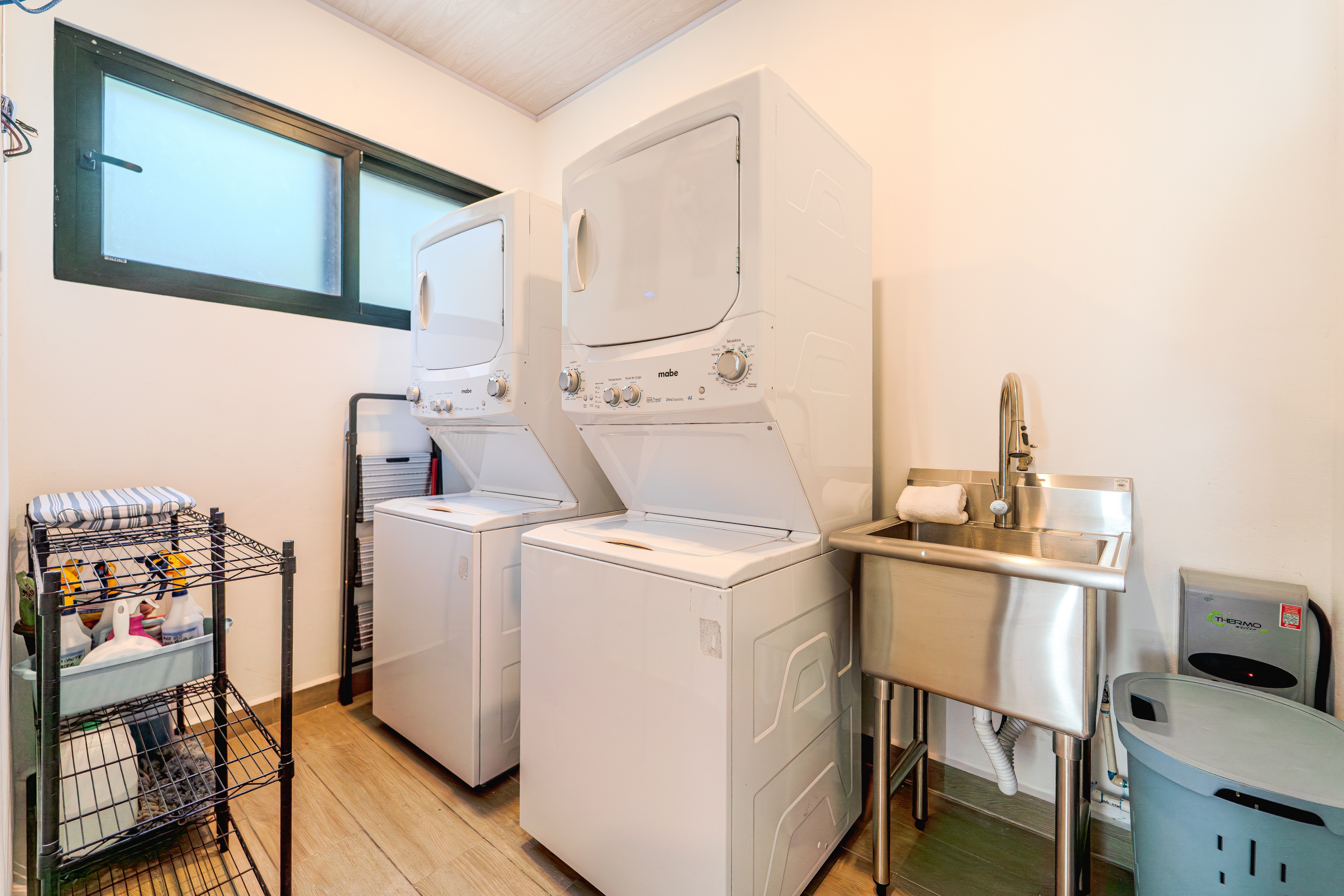 Two washers, two dryers — twin stacked units. Pack light, stay long.