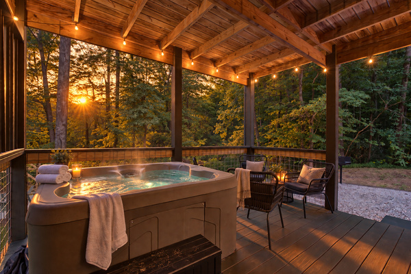 Private hot tub on the covered deck with sunset views, fresh towels and robes