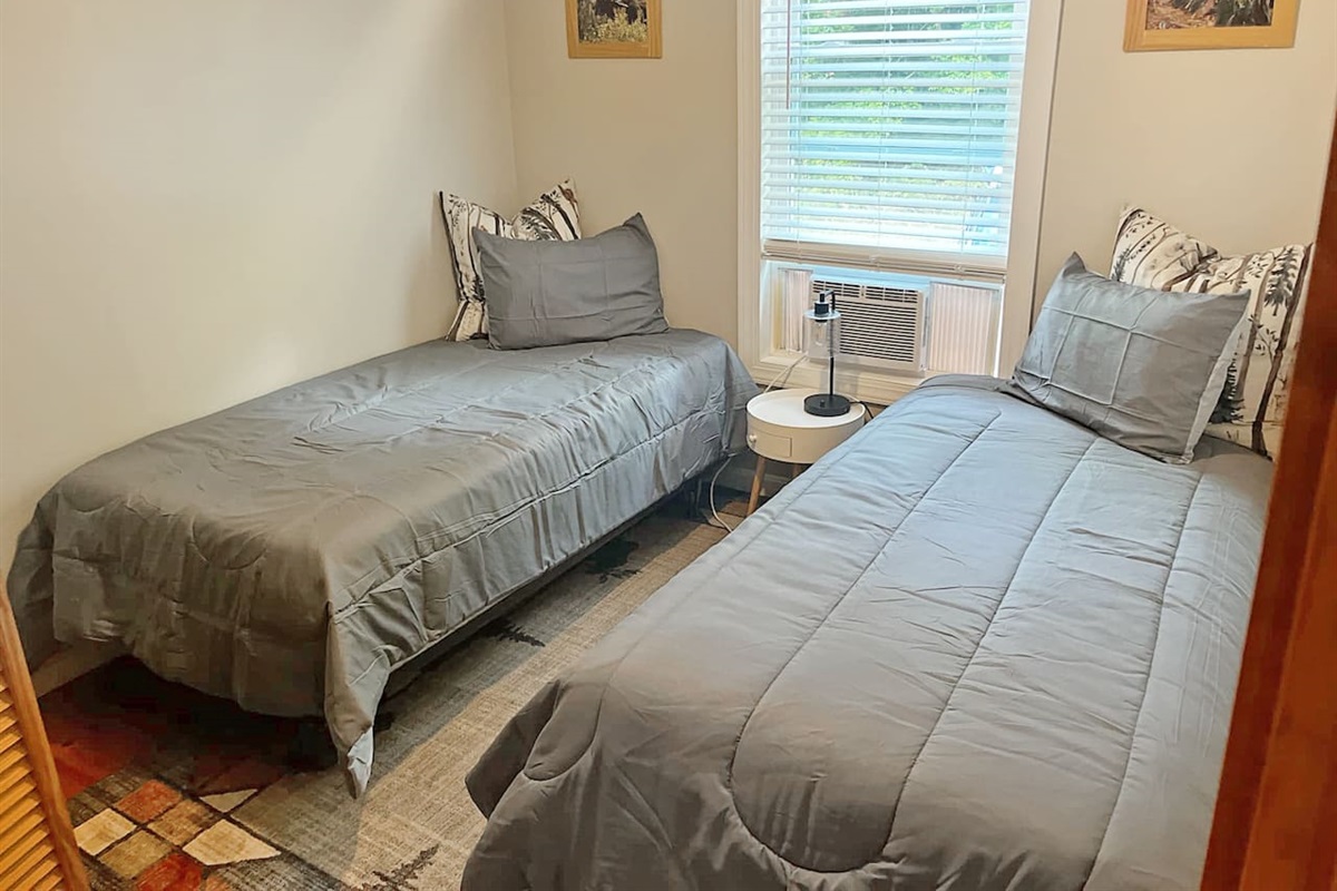 Bedroom 3 has 2 twin bed and a closet to hang your clothes! 