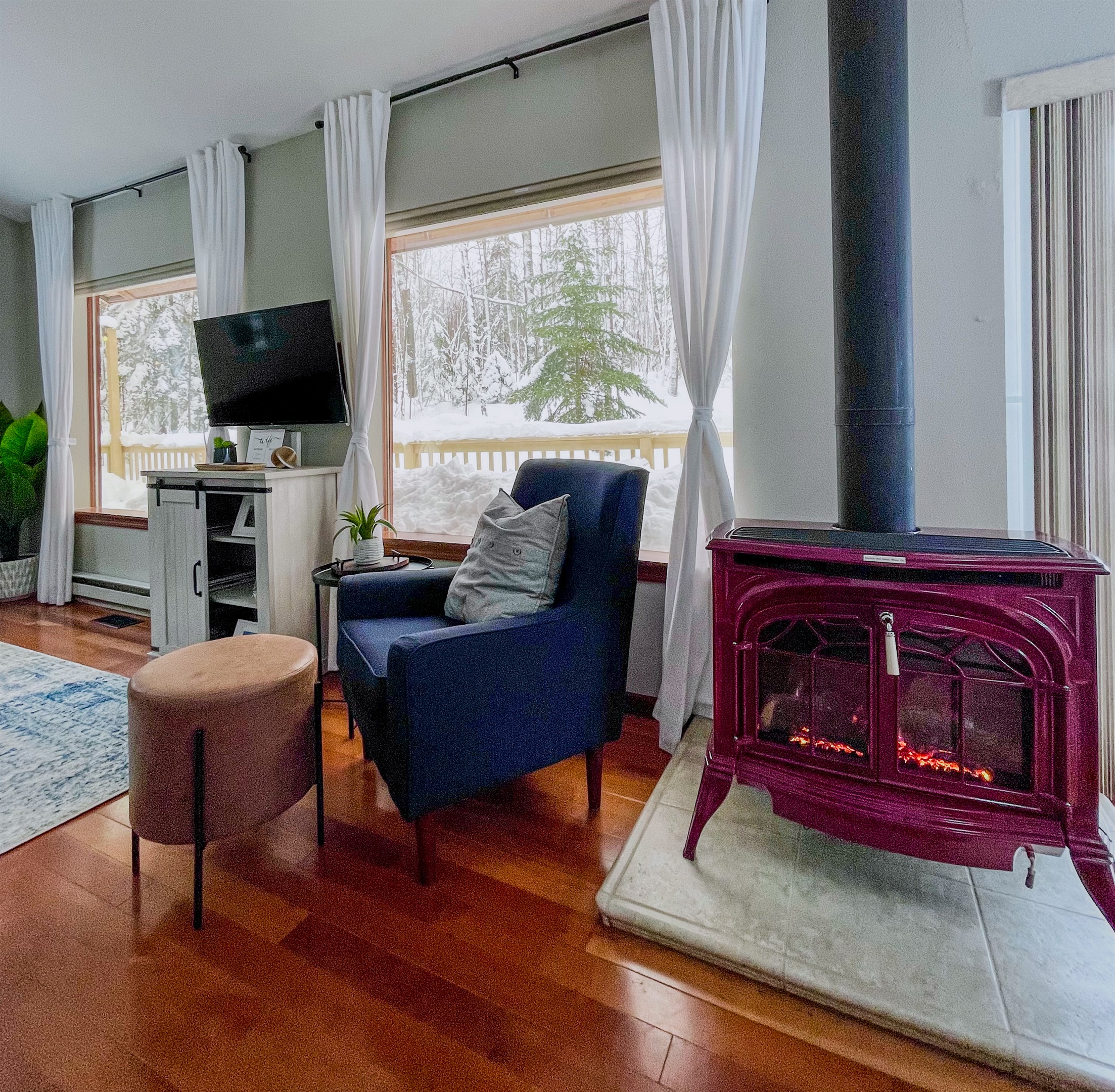 Views out the two huge panoramic window in the living room in the winter scene snow (poss Dec-March likely snow accumulation) 
