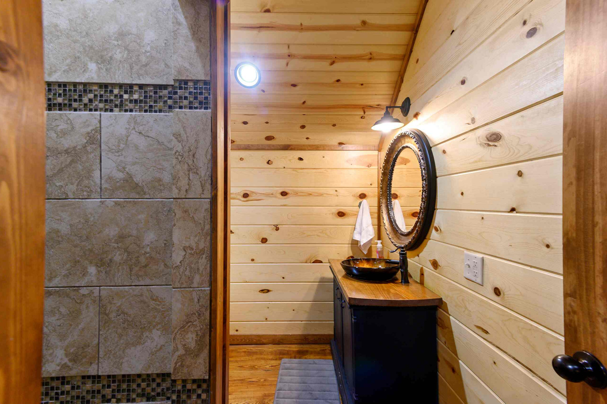 Elegant Bathroom: Discover rustic charm with modern amenities and inviting natural light!