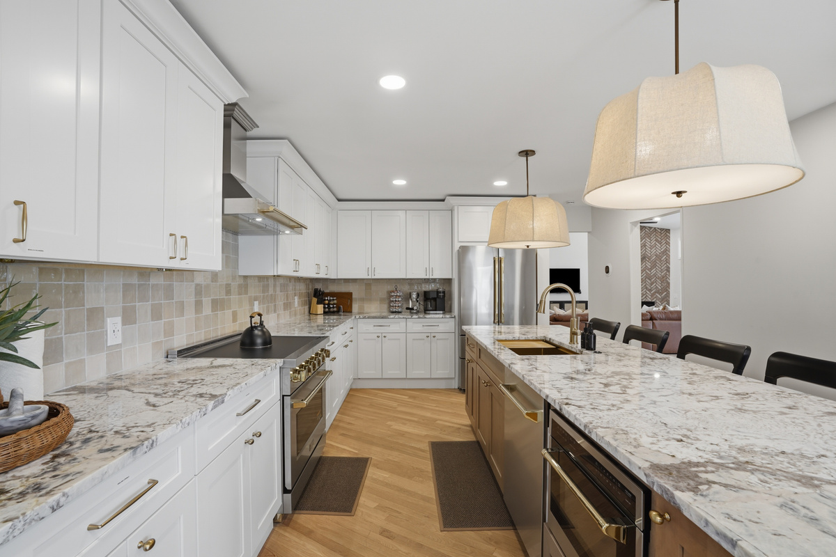 Cook with ease in the fully equipped chef’s kitchen, featuring premium appliances, expansive countertops, and generous prep space for group meals.