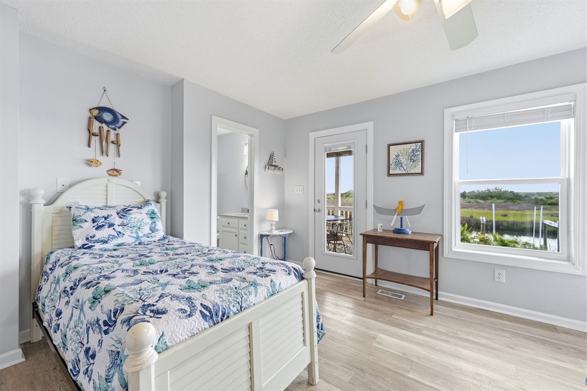 Sleep, play, and step right out onto the deck from this room.