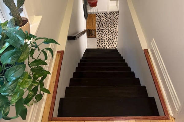 Stairway connecting the spacious room of the home.