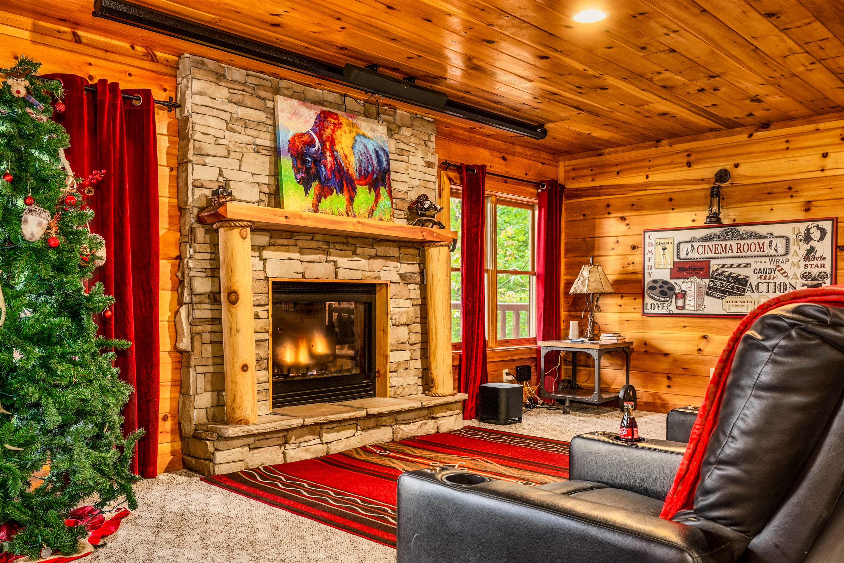 Large screen pulls down in front of the fireplace (when turned off).