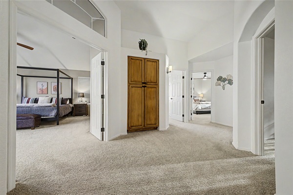 Upstairs Hallway: Spacious layout connecting beautiful bedrooms in a serene retreat. 