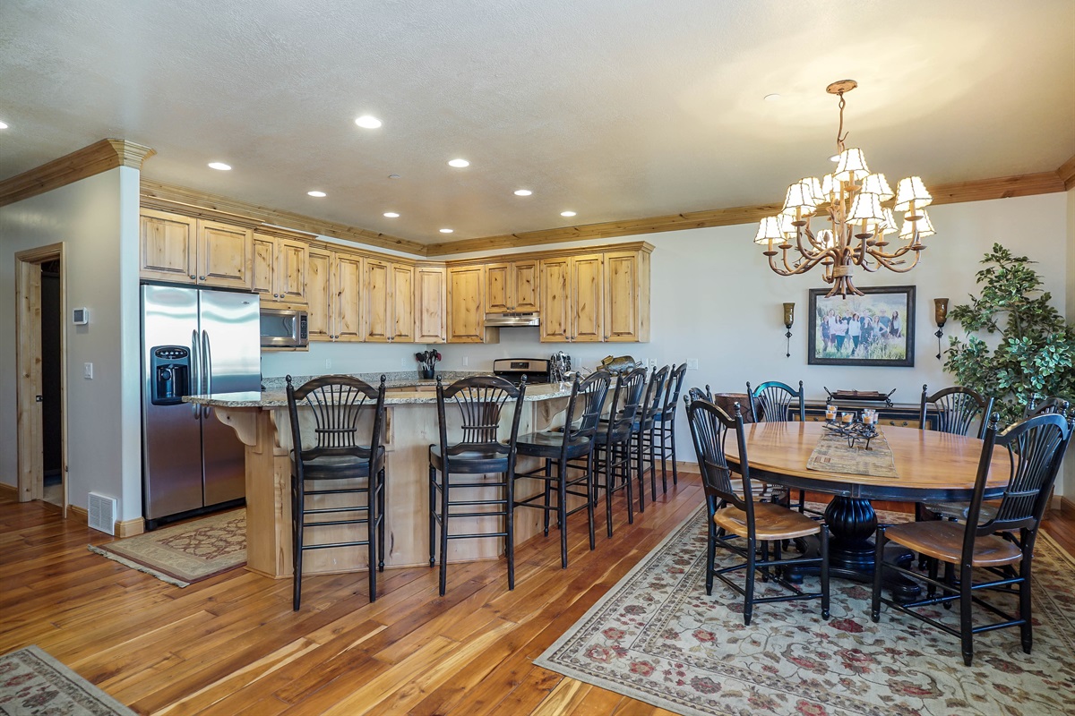 Large kitchen and dining area with bar seating—perfect for entertaining family and friends.