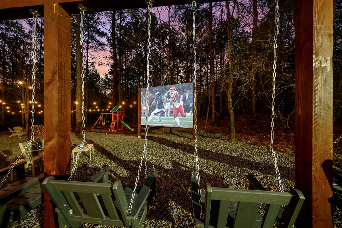Porch swings + outdoor projector screen = family fun. 