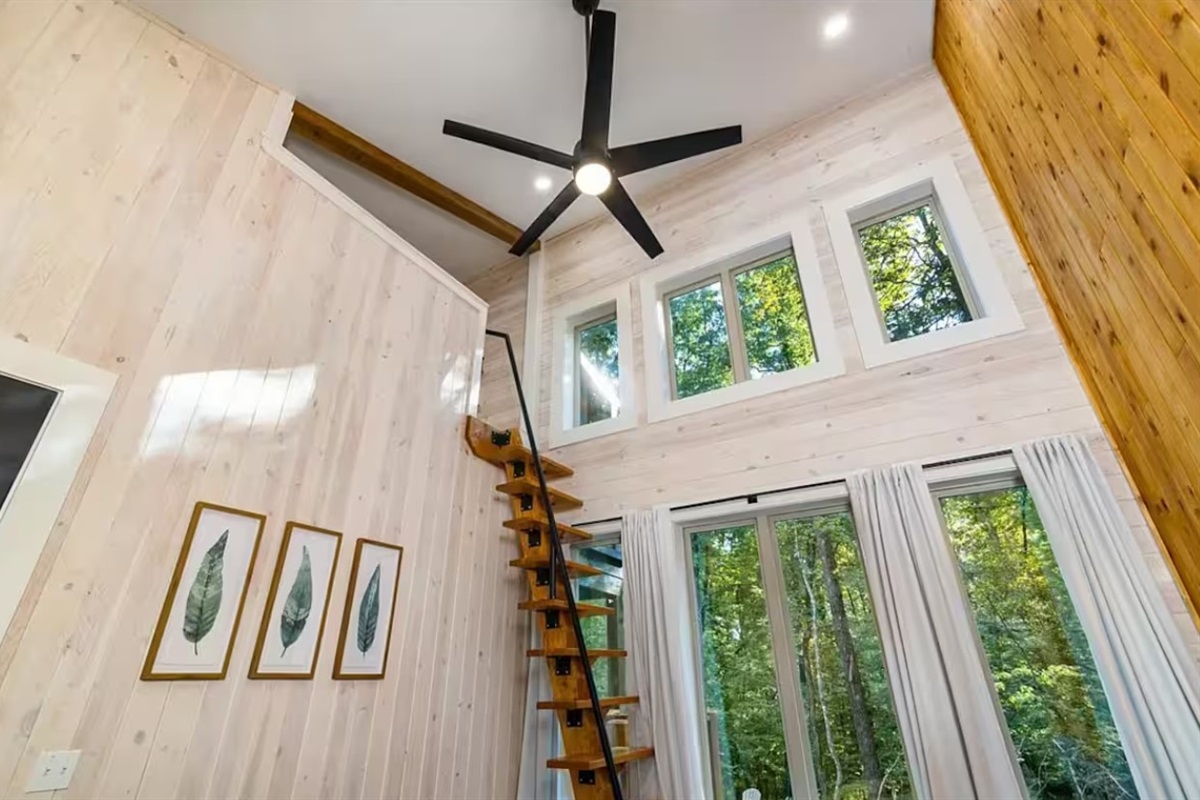 Climb the stairs to find a full bed in the loft