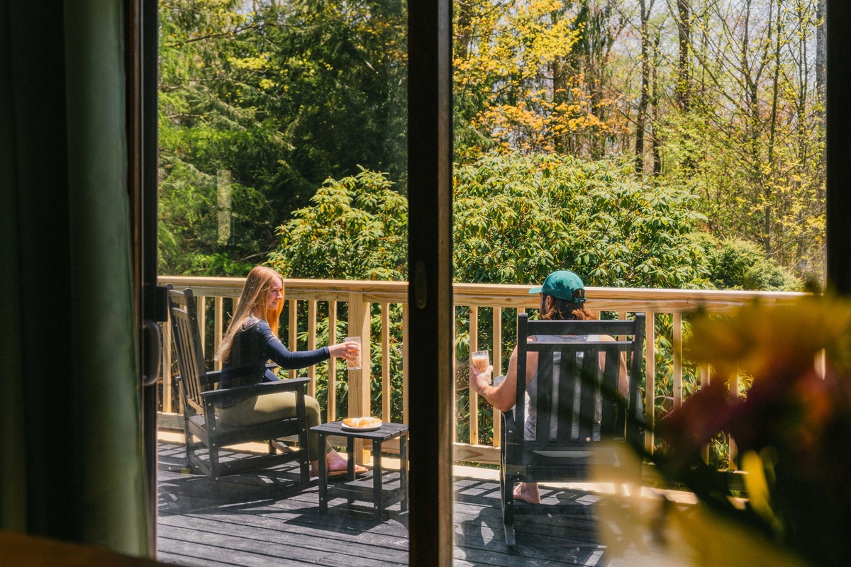 🪑 Hanging egg chairs and rockers — the deck's best seat in the house.