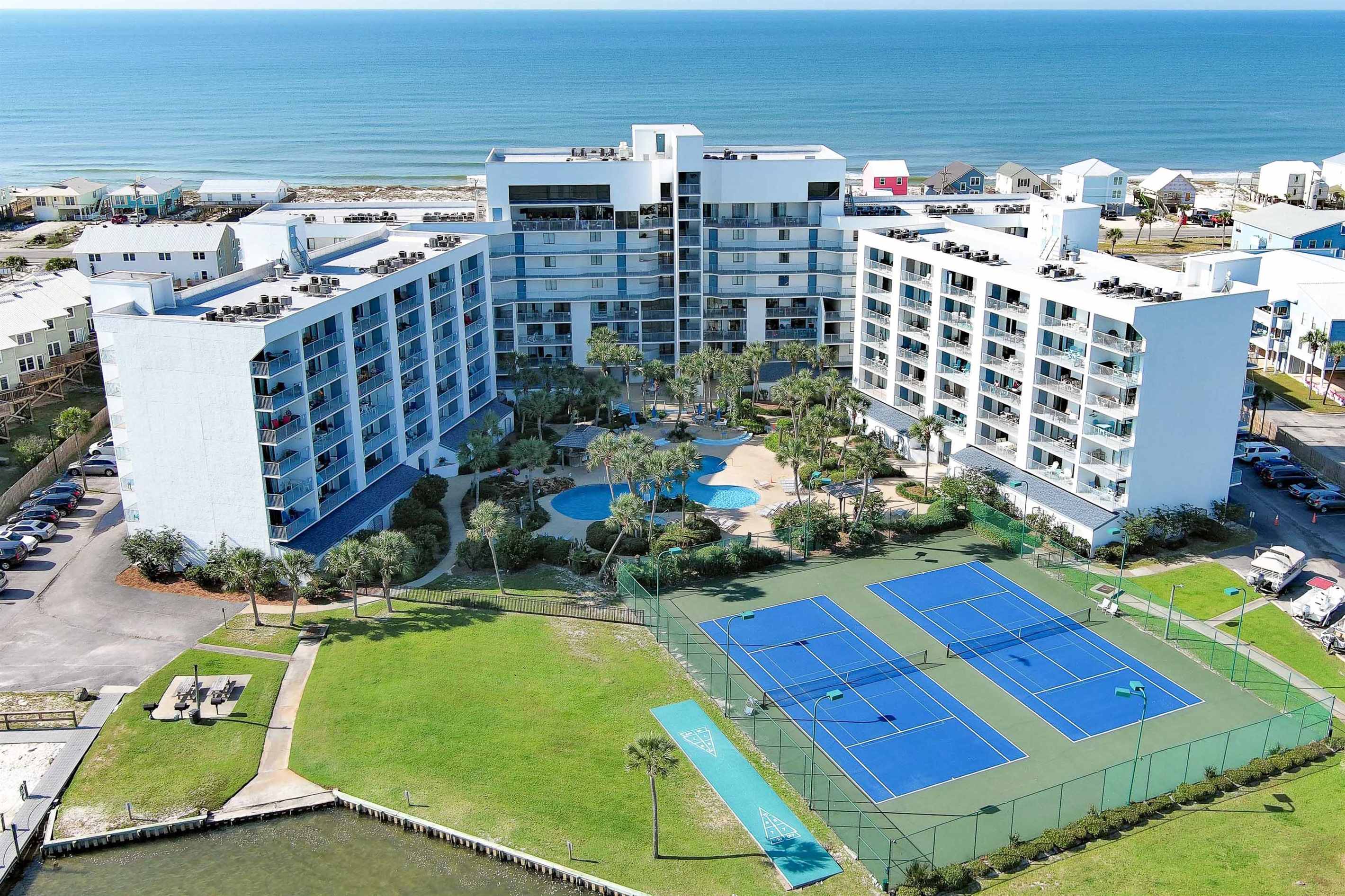 Enjoy world-class amenities including tennis courts, a tropical pool, and private boat slips on Little Lagoon.