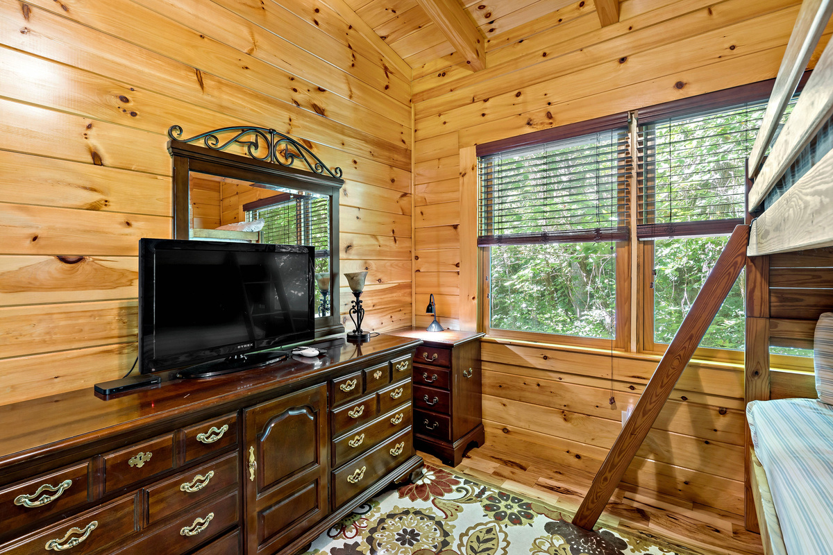 Tv and dresser in the bunk room