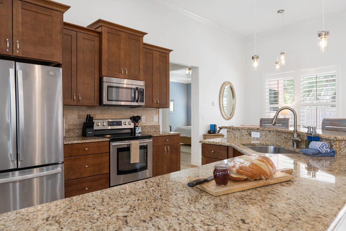 Stainless range, microwave and fridge with granite counters, so cooking family dinners in feels easy and relaxed.