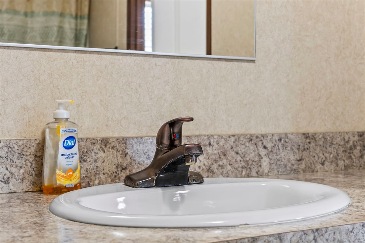 Detailed view of the sink and countertop, offering a clean and practical space for everyday use.