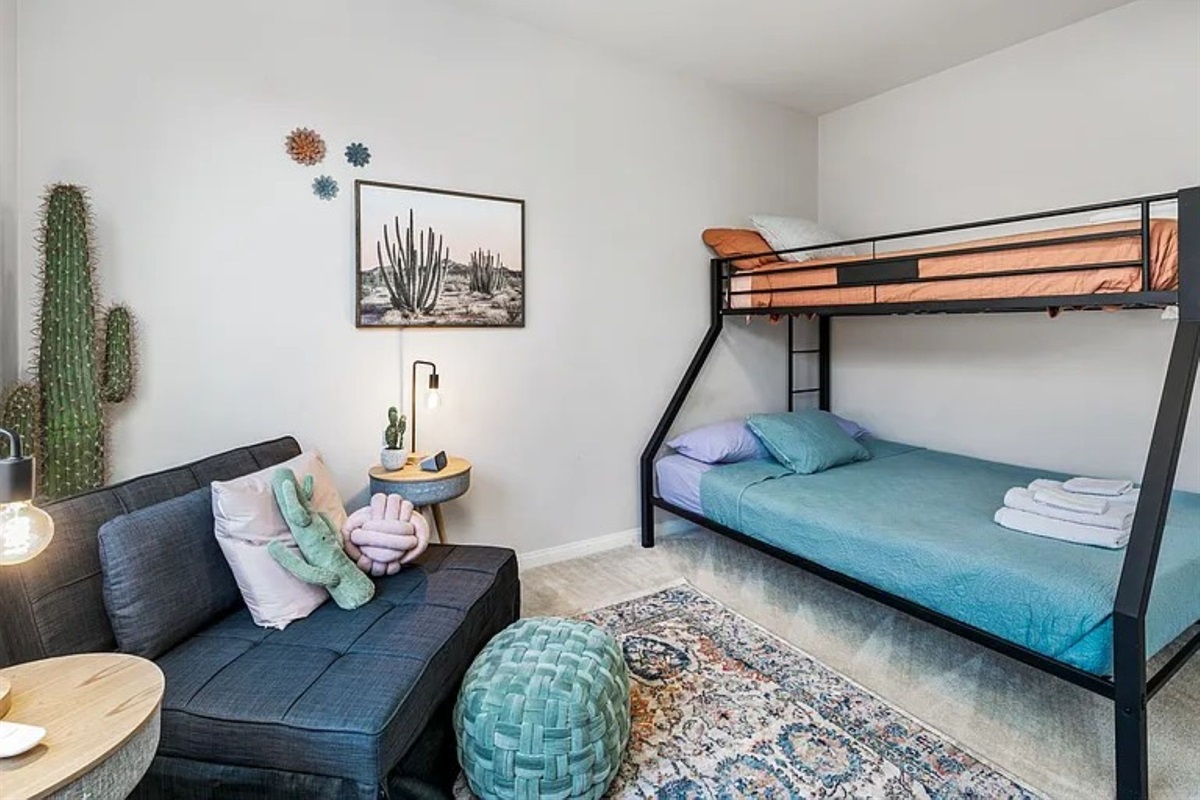 3rd bedroom full bed bottom twin top and chair folds into twin