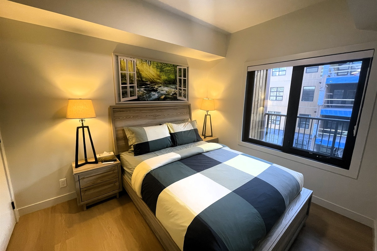 Main bedroom window open onto your private balcony with partial mountain view. 