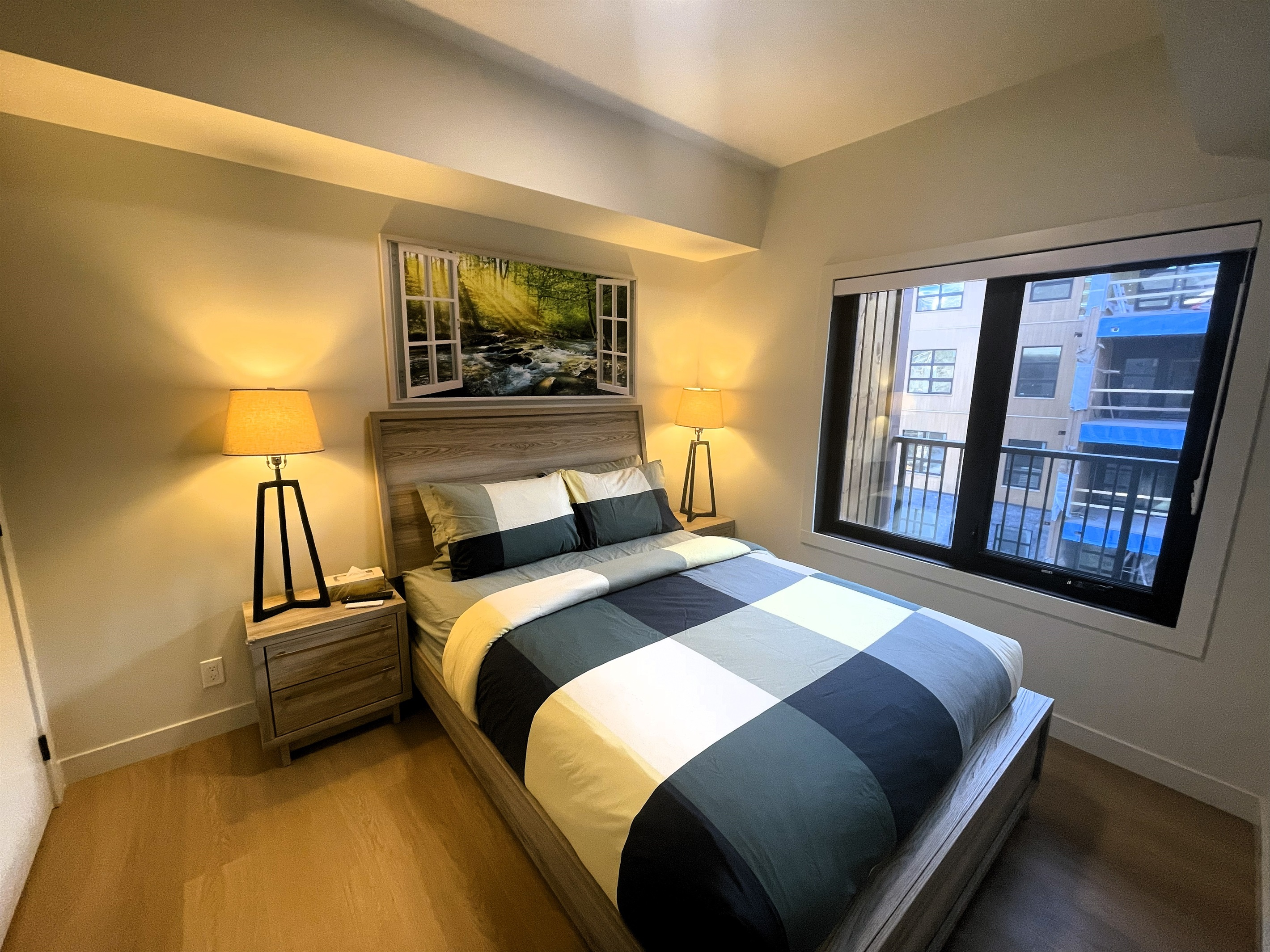 Main bedroom window open onto your private balcony with partial mountain view. 