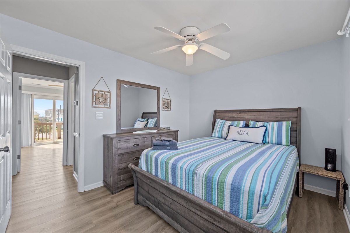 Second queen bedroom features dresser and mirror