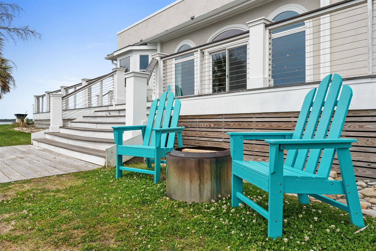 Gather around the waterfront fire pit with Adirondack seating just steps from the deck