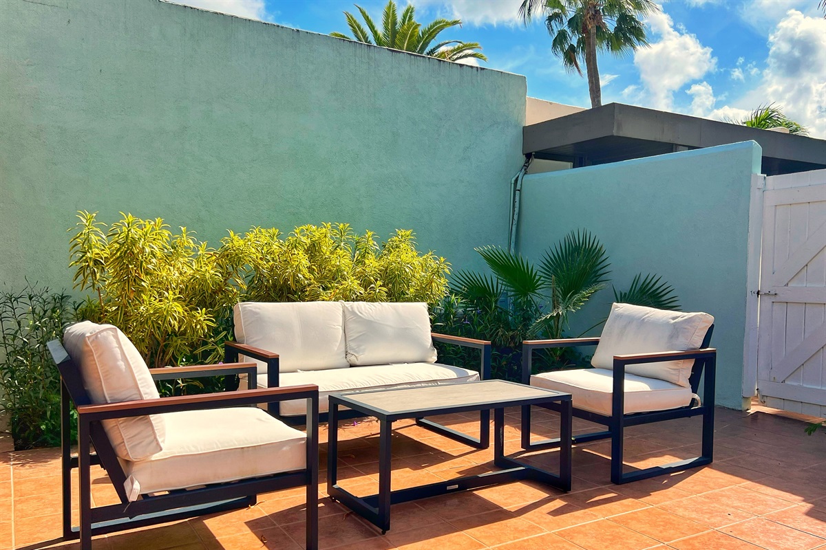 Enjoy fresh air and comfortable lounging in this thoughtfully designed outdoor space. 