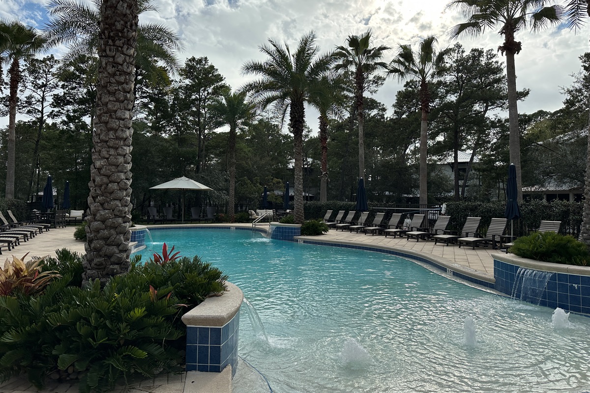 Resort-style pool just steps away through the stone path. Shared only with Creek Park at Magnolia homes, it features a zero-entry design perfect for kids and lounging under the palms. ☀️