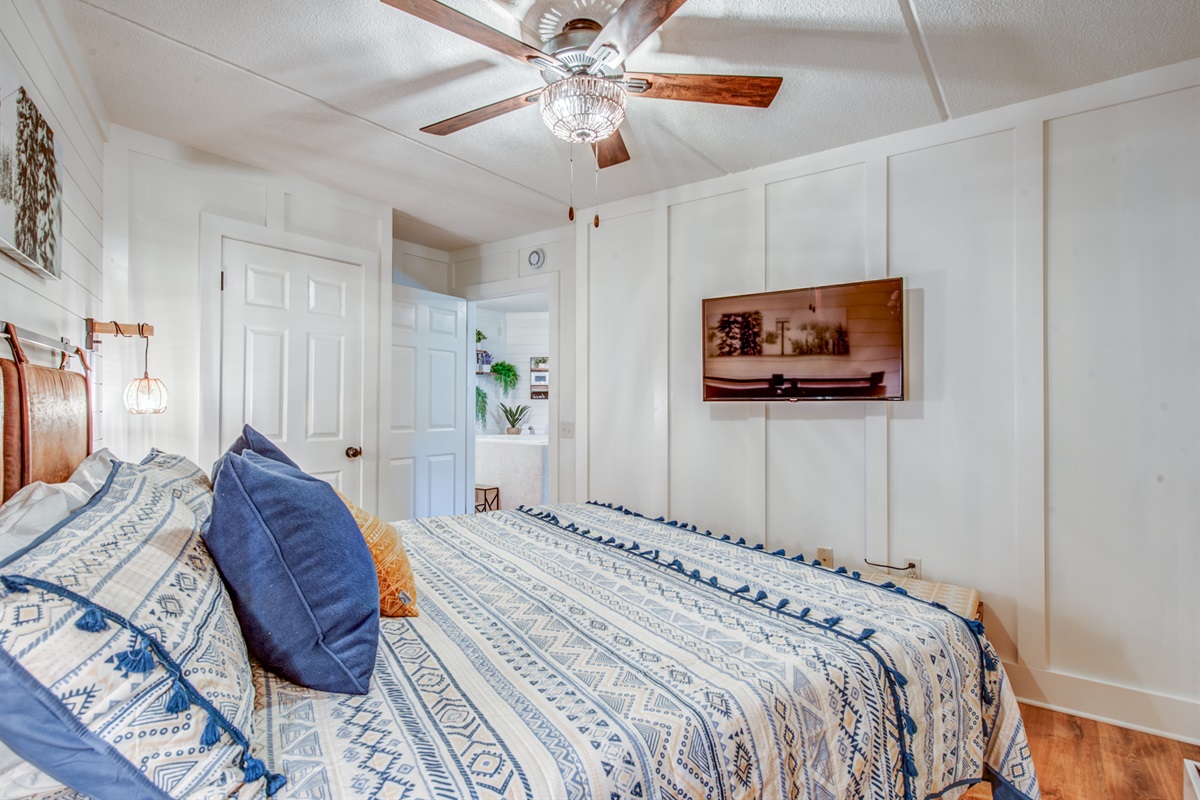 King Bedroom with tv and ceiling fan and own ac & heat unit 