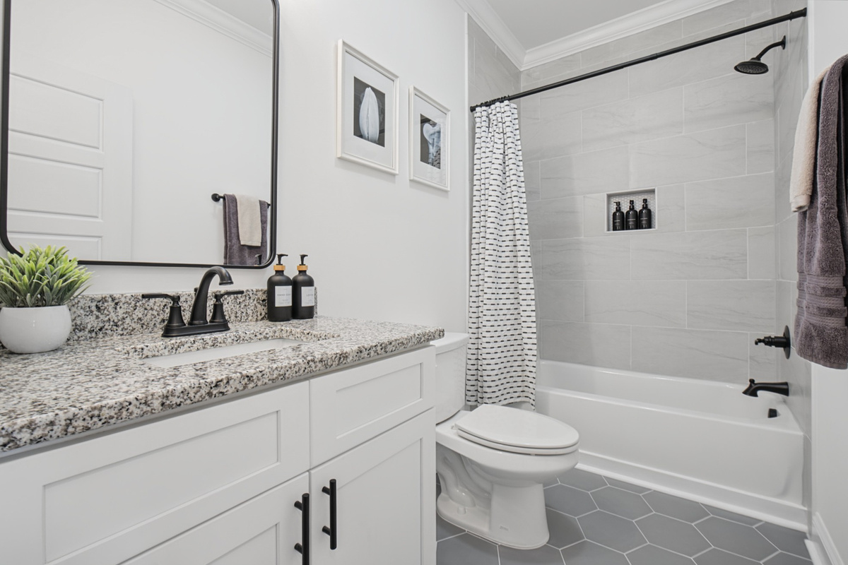 Second full bath upstairs with a tub and shower combo