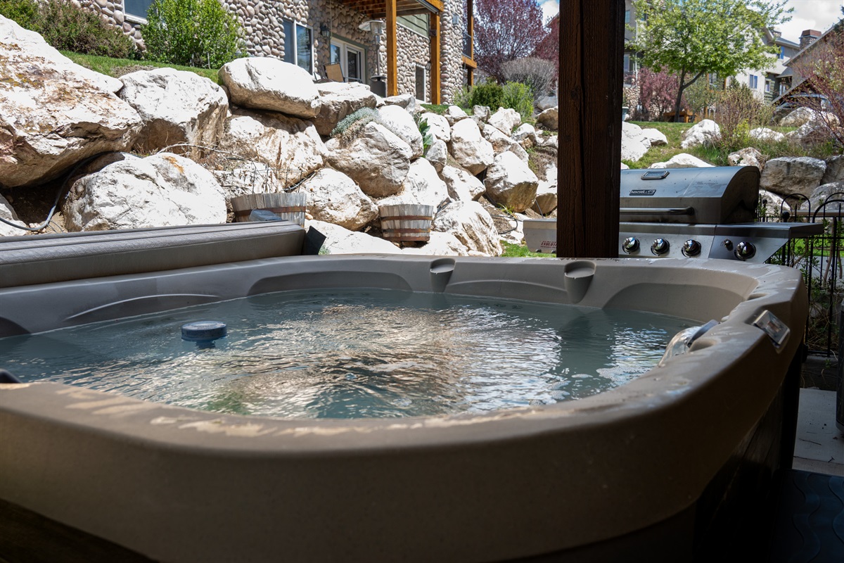 Sink into the private hot tub and let the mountain air melt your stress away.