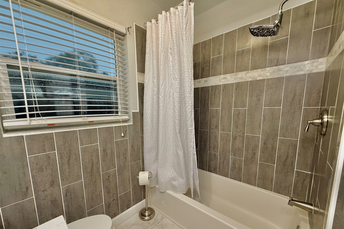 Start your day in a sparkling clean space with modern fixtures, soft lighting, and all the essentials waiting for you.