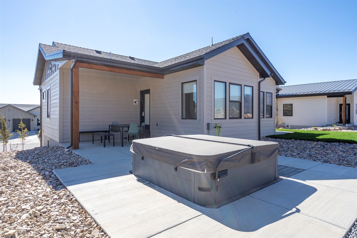 Private hot tub on the patio, ideal for unwinding after a day of adventure.