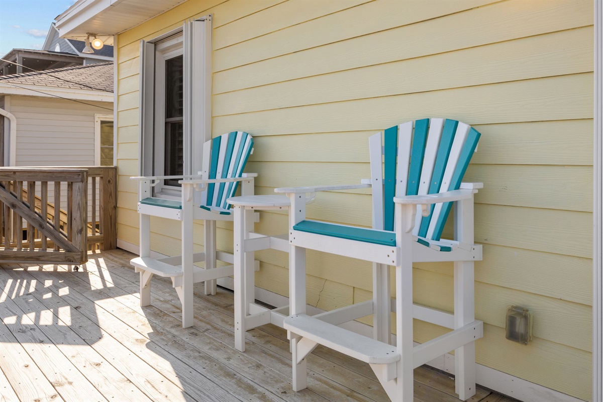 Bar-height deck chairs perfect for sunset drinks