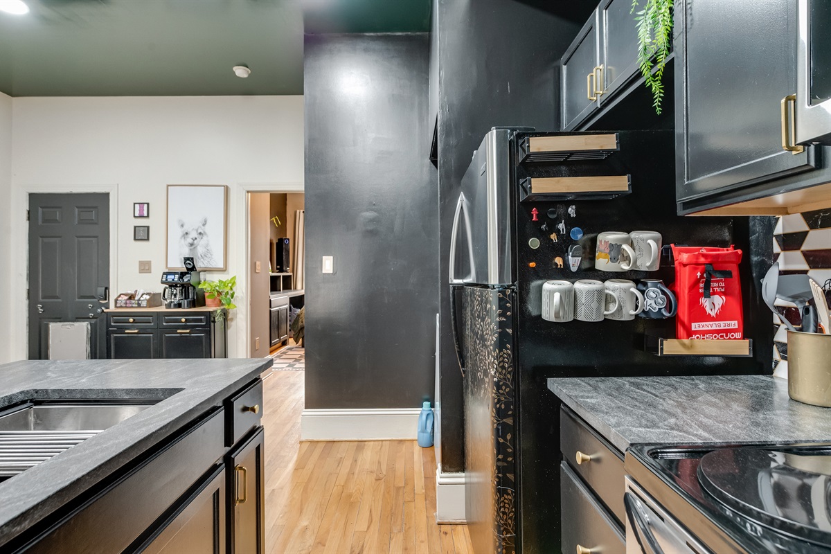 Kitchen Delight: Modern design meets functionality with sleek cabinetry and stylish decor!