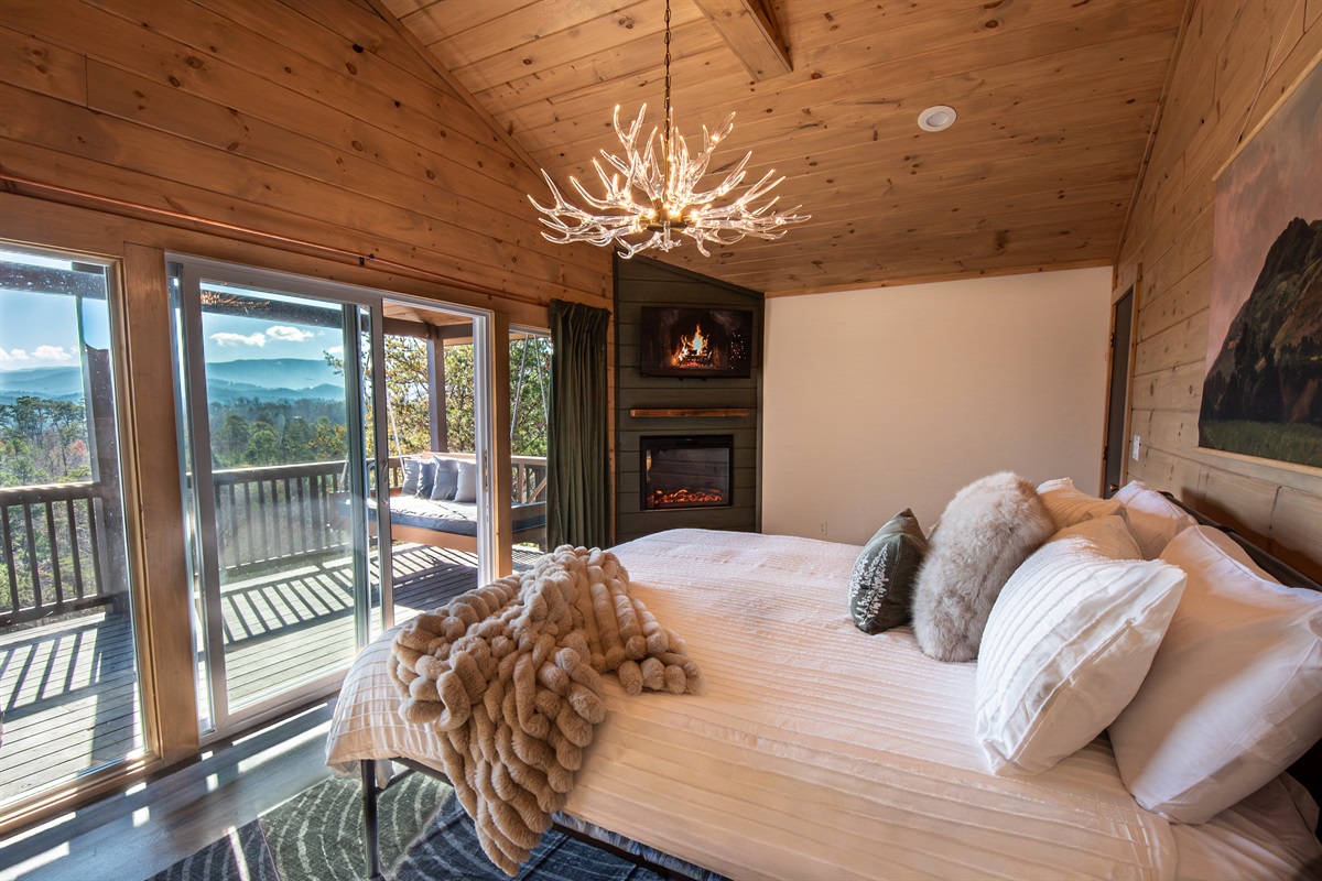 Wake up to our glass wall, mountain view upper deck from the comfort of the primary king suite!