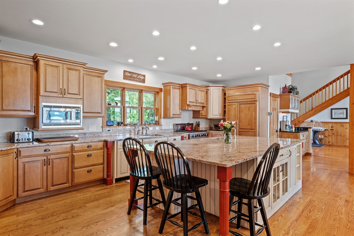 Fully stocked kitchen with massive island, viking range, sub zero fridge, dual beverage centers, and every you could need to cook like a chef and host all your guests