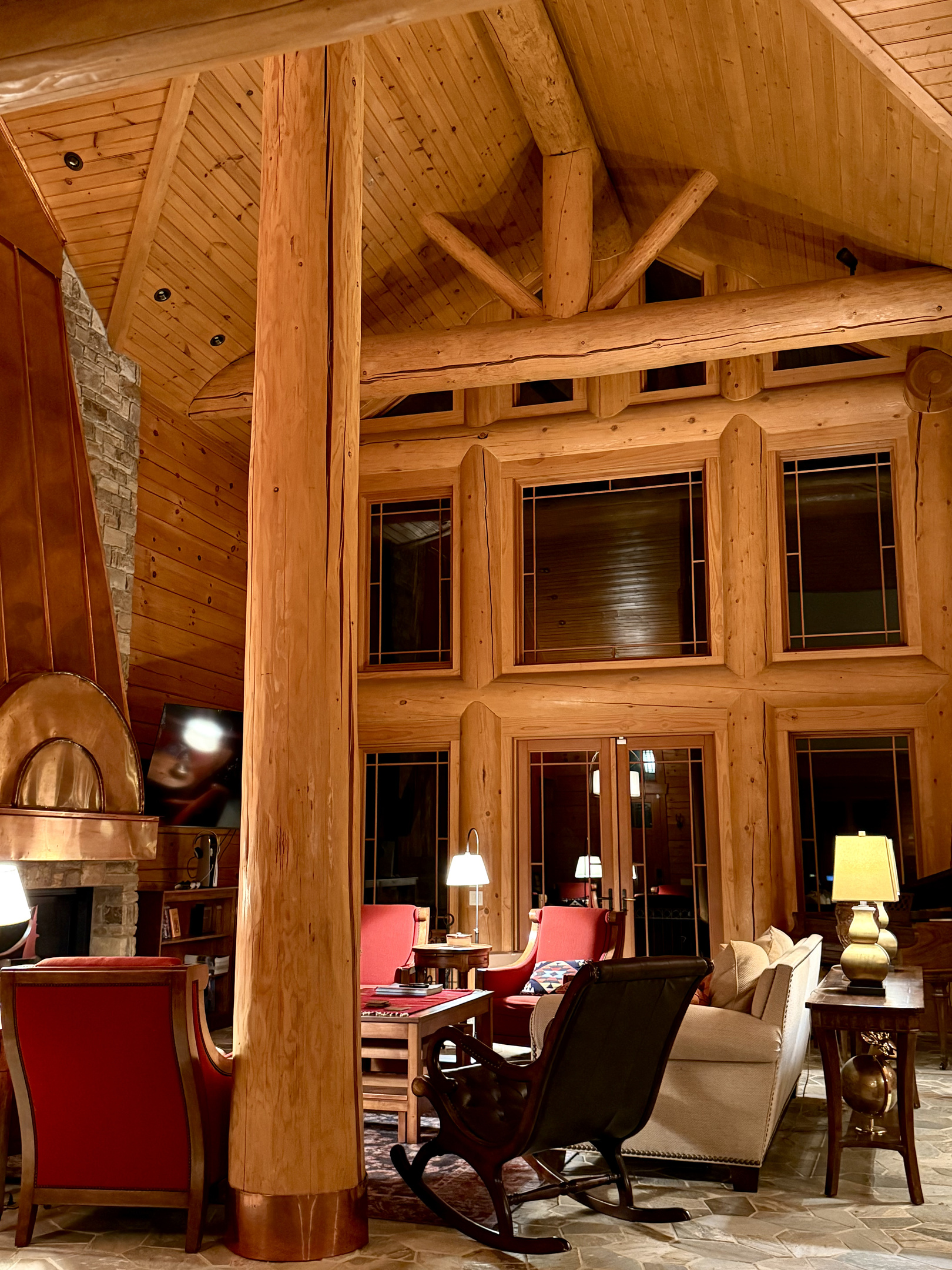 As the sun goes down, the open-concept living room becomes the perfect retreat for cozy conversations, games, or a quiet night in.